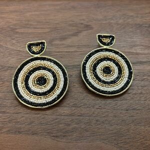 Ink and Alloy Stella Circular beaded earrings.